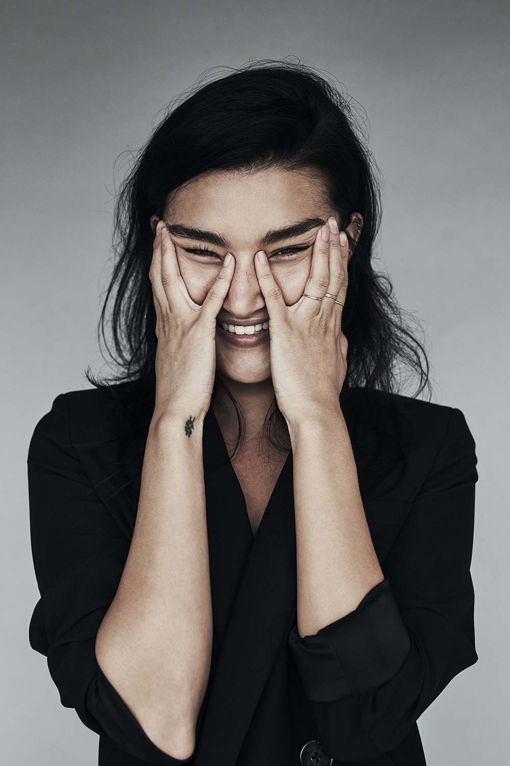 Smiling portrait with hands framing the face